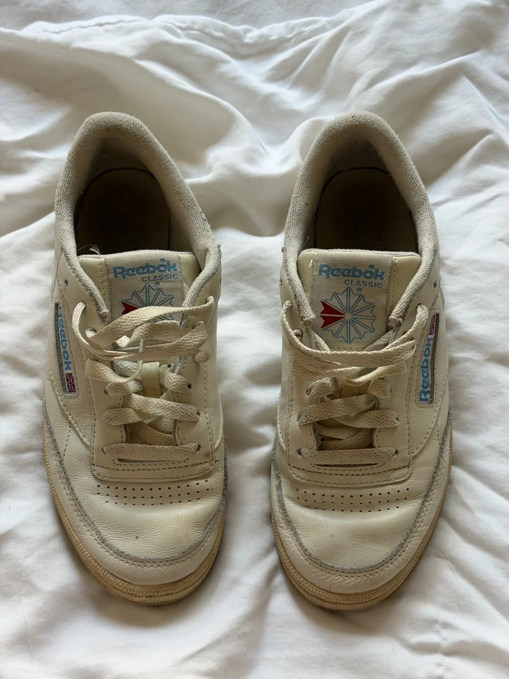 Reebok Kids Classic Leather Sneaker in Off-White with Blue and Red Accents